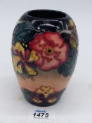 A Moorcroft vase in barrel shape, 'Oberon' pattern, 5 1/4" tall.