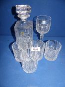 A Decanter and four matching cut glass tumblers (one a/f.), plus a crystal wine glass.