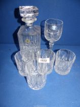 A Decanter and four matching cut glass tumblers (one a/f.), plus a crystal wine glass.