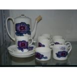 A Wedgwood Susie Cooper 'Anemone' design part coffee set, one saucer a/f.