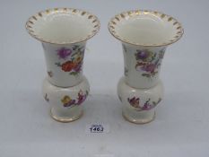 A pair of Dresden hand painted floral vases, some chips, 6 1/4'' tall.