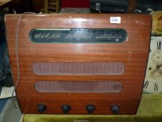 A Murphy A122 receiver radio with Bakelite knobs, 22" x 8" x 18".