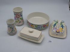 A small quantity of Poole Pottery to include fruit bowl, vases, cheese dish and butter dish.