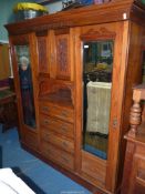A good probably Edwardian Double Wardrobe the centre with a recess having a cupboard over with
