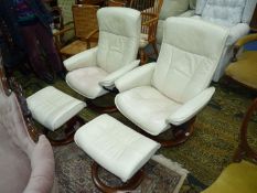 A pair of cream upholstered Ekornes Stressless reclining Armchairs complete with the associated