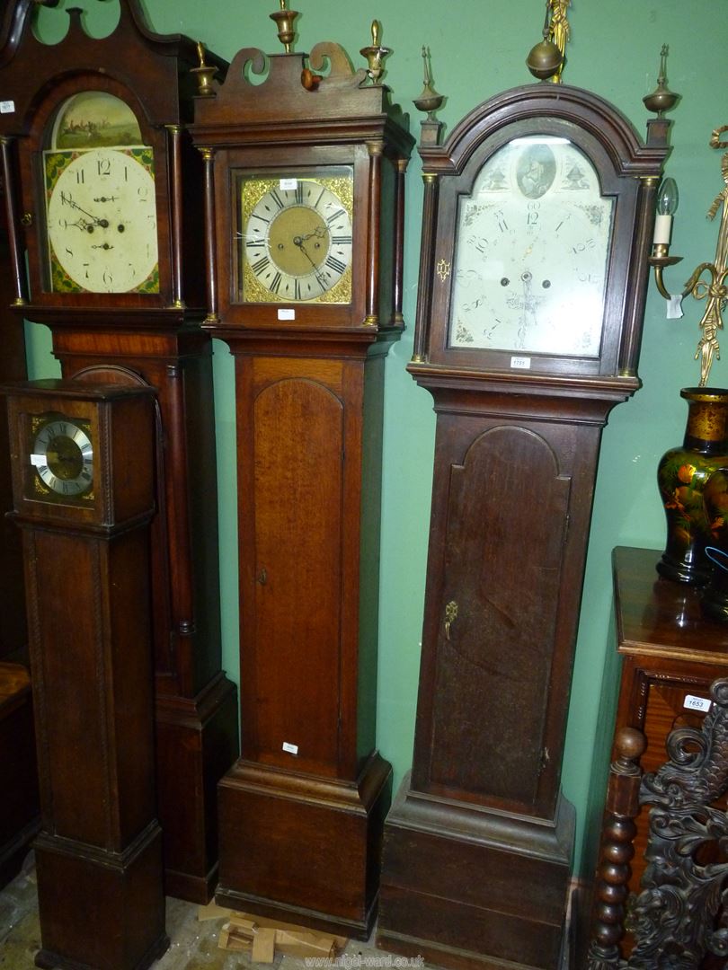 An Oak cased long-case Clock having an eight day movement striking the hours on a bell,