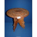 A foliate carved three legged Occasional table (fixed base), 15'' diameter x 15'' high.