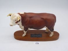 A Beswick Connoisseur model of a Hereford Bull on plinth.