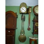 An unusual two train upright driven movement Wall CLock having a domed 8 1/4'' diameter white