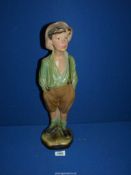 A chalk figure of a Whistling Boy, 18 1/2'' tall.