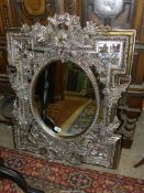 A contemporary moulded Wall Mirror of foliate and floral design,