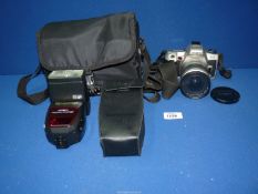 A Minolta camera, 505SI Super with AF200 zoom, flash and carrying case.