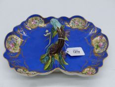 A two section dish with Majolica style handle with berry leaf detail,