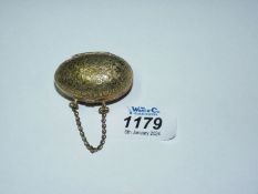 A very pretty egg shaped brass engraved thimble case.
