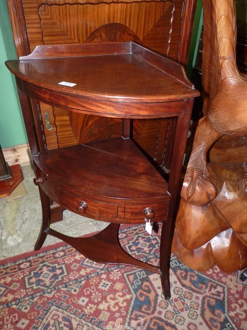 A Georgian Mahogany corner Washstand having a frieze drawer,