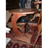 An unusual arts and crafts occasional Table having an oval ten sided crossbanded top,