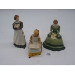 Three Franklin Mint figures of characters from Little Women: 'Jo', 'Amy' and 'Meg'.