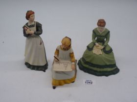 Three Franklin Mint figures of characters from Little Women: 'Jo', 'Amy' and 'Meg'.