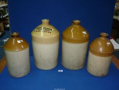 Four stoneware flagons including two marked 'Edward Ridlington, Wine & Spirit Merchant,