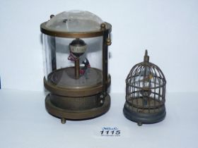 Two Automation clocks, one with two tropical fish, 4 1/2'' tall x 4'' diameter,