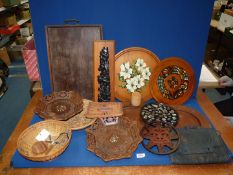 A quantity of treen to include fruit baskets, platters, carving of totem, etc.