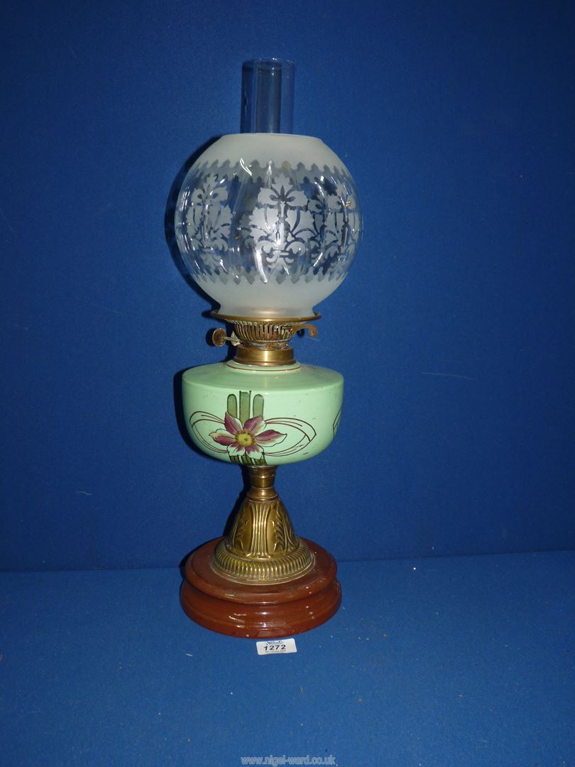 An oil lamp with ceramic base, brass column,