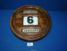 An early 20th century large circular office - station perpetual calendar, 12" diameter.
