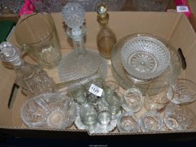 A quantity of glass including decanters, sherry glasses on a carousel,