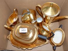 A mixture of gold china to include Grimwades Royal Winton creamer and leaf plate,