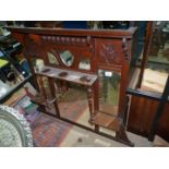 A Mahogany over mantel Mirror having multiple bevelled mirrors and a shelf with turned supports,