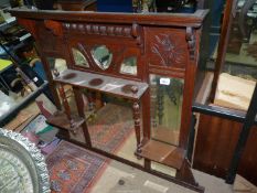 A Mahogany over mantel Mirror having multiple bevelled mirrors and a shelf with turned supports,