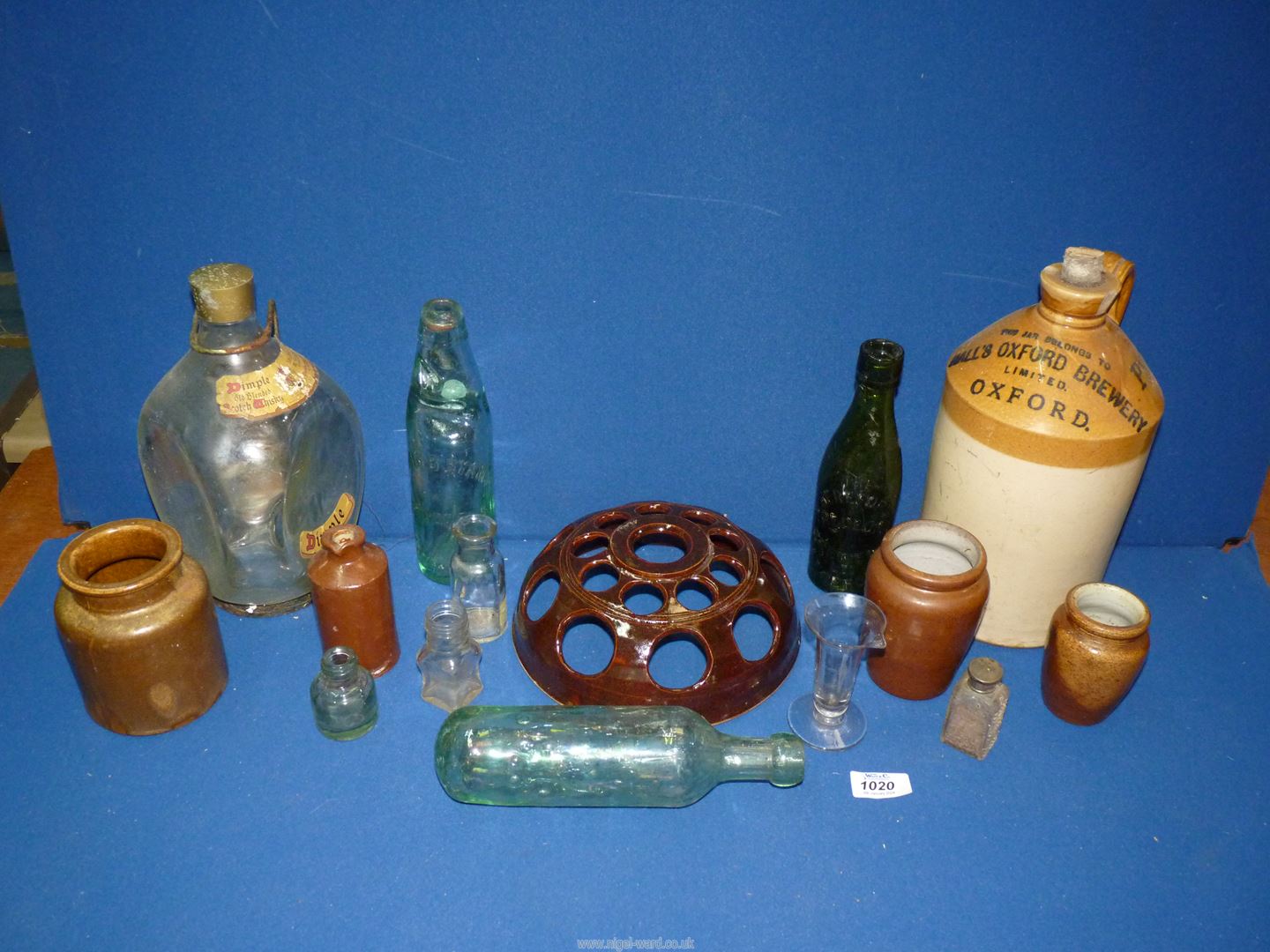 A quantity of glass and stoneware including hand blown measuring beaker (chip to rim),