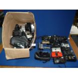 A box of film cameras including Pentax, Olympus, Chinon, Sony Handycam etc.