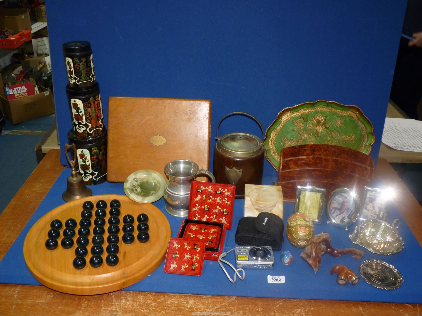 A quantity of miscellanea including a letter rack, bell, oriental tea tin, onyx dish etc.