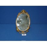 A pretty Brass framed free standing/hanging Mirror, 9" tall.