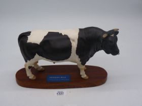 A Beswick Connoisseur model of a Friesian Bull on plinth,