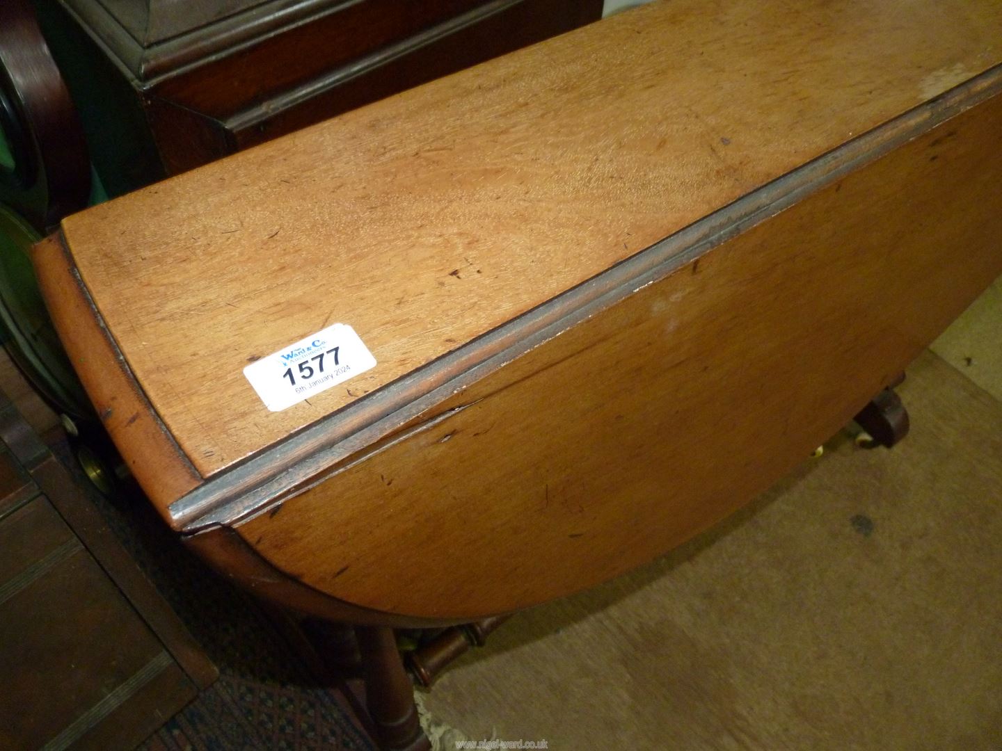 A circa 1900 Satinwood Sutherland type Table standing on turned supports and stretchers and being - Image 4 of 4