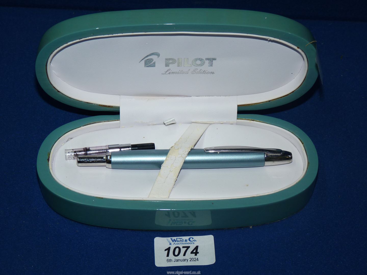 A Pilot retractable fountain pen, limited edition and cased, some wear.