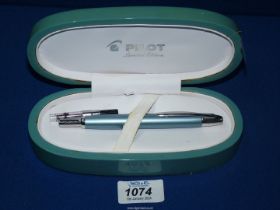 A Pilot retractable fountain pen, limited edition and cased, some wear.