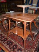 A circa 1910/1920 Mahogany/Satinwood occasional Table having swept moulded detail legs united by a