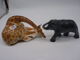 A USSR giraffe figure and an elephant figure.