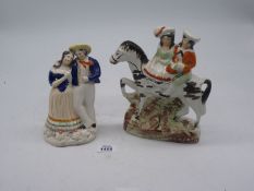 Two Staffordshire Flat backs including a couple on horseback and a courting couple, 9'' and 7 1.