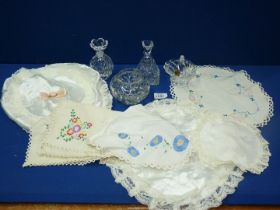 Two embroidered linen table mats, plus a 'Galway 24% lead crystal' bottle, and flower scent bottle,