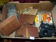 A quantity of Stereoscope slides with parts of a slide holder box of oriental design but all needs