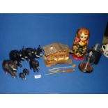 A quantity of miscellanea including graduated ebonised elephant family, Matryoshka doll, hip flask,