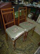 A pair of possibly Maple wood framed elegant side Chairs having light and darkwood stringing to the