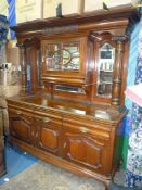A most substantial and imposing Satinwood mirrorback Sideboard having three cupboards to the base