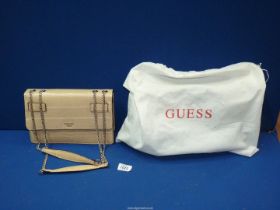 A 'Guess 1981' faux crocodile skin handbag in nude colour, with chain handles and dust bag.