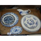 A quantity of blue and white china including plates, pin trays, sauce boat etc.