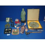 A quantity of Oriental items including purses, whistle, figure (a/f), bells, china head, etc.